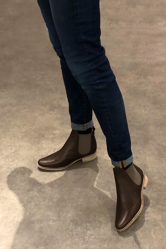 Dark brown women's ankle boots, with elastics. Round toe. Flat leather soles. Worn view - Florence KOOIJMAN